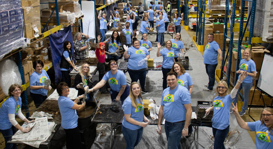 Modern Woodmen employees wrap trees in labor of love